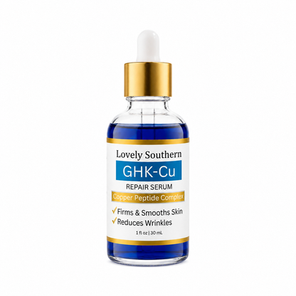 A 30 mL dropper bottle of Lovely Southern GHK-Cu Repair Serum. The bottle is made of clear glass showing dark blue liquid inside, topped with a shiny gold collar and a white rubber dropper.